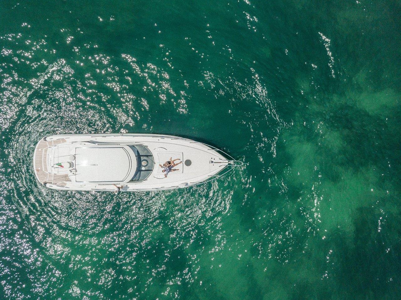 A large yacht in blue ocean waters.